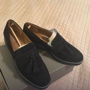 Women’s Black suede loafers with a tassel.